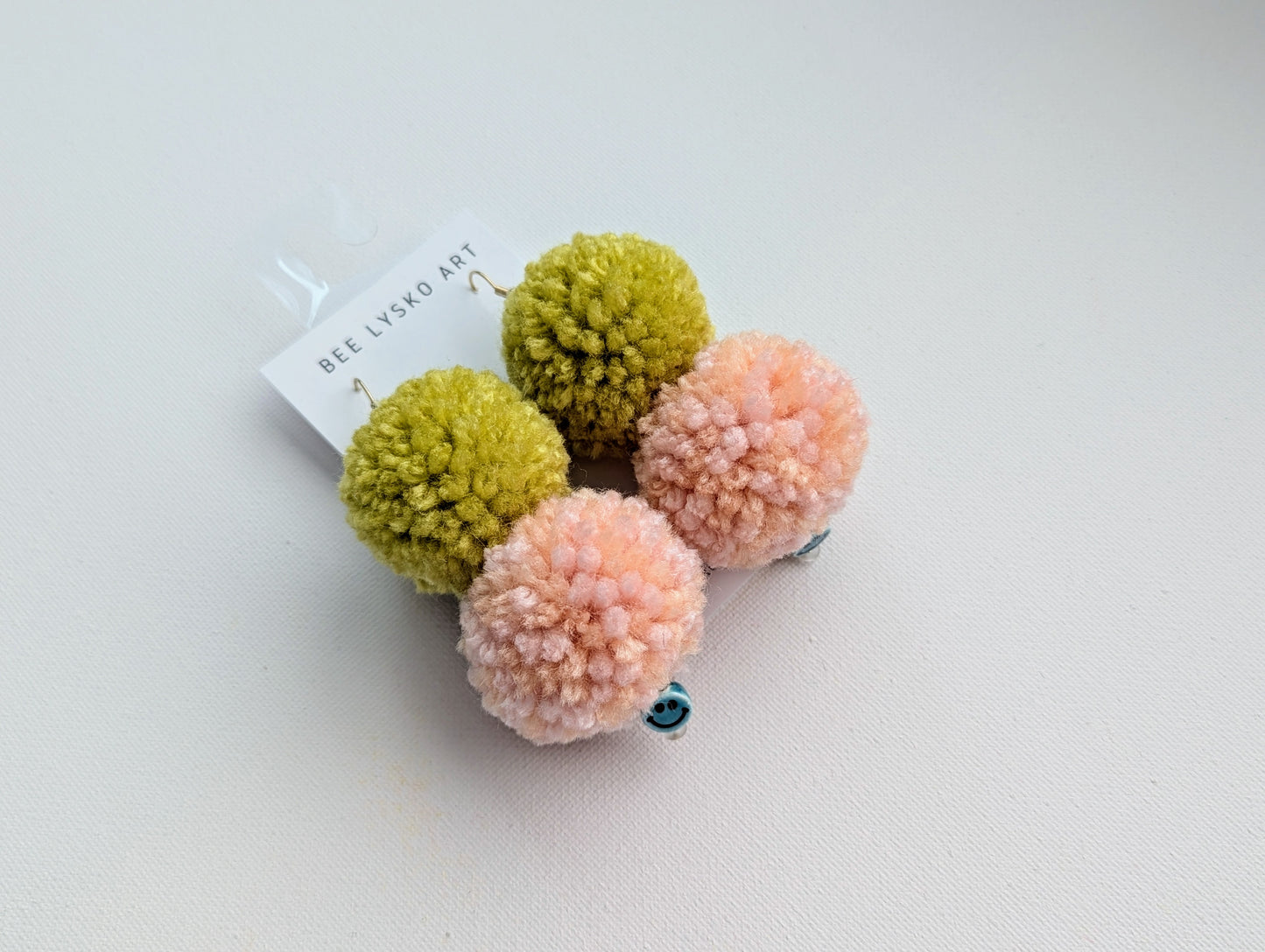 Double Smiley Poms