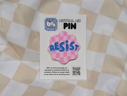 RESIST Pin - Pink Checks