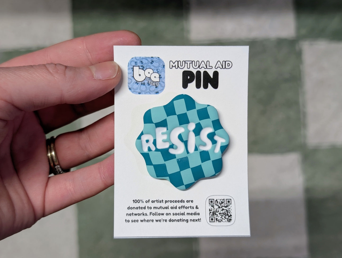 RESIST Pin - Teal Checks