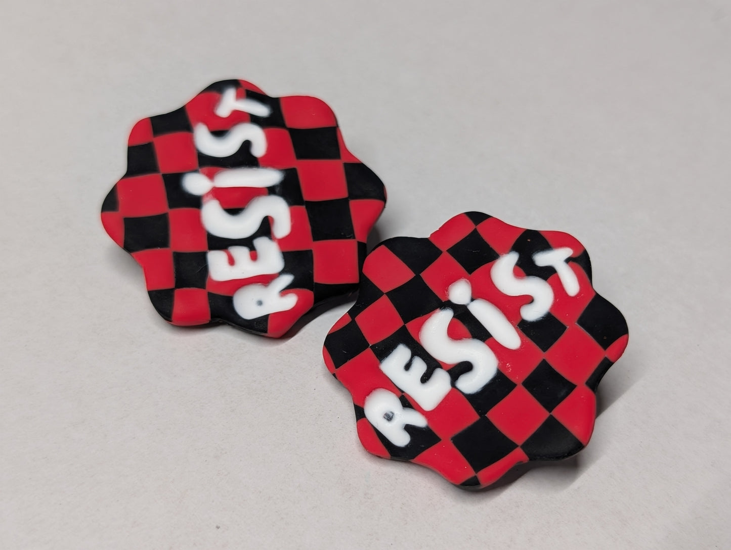 RESIST Pin - Red Checks
