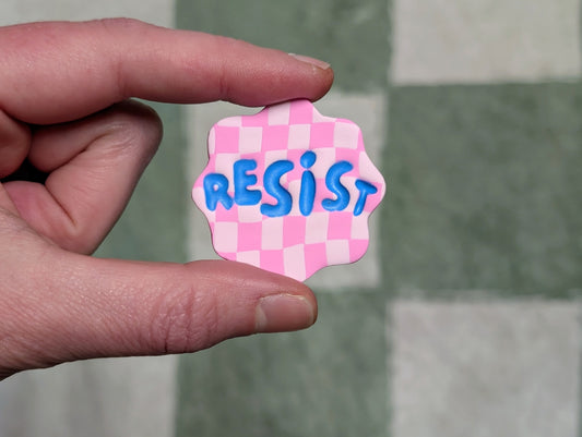RESIST Pin - Pink Checks