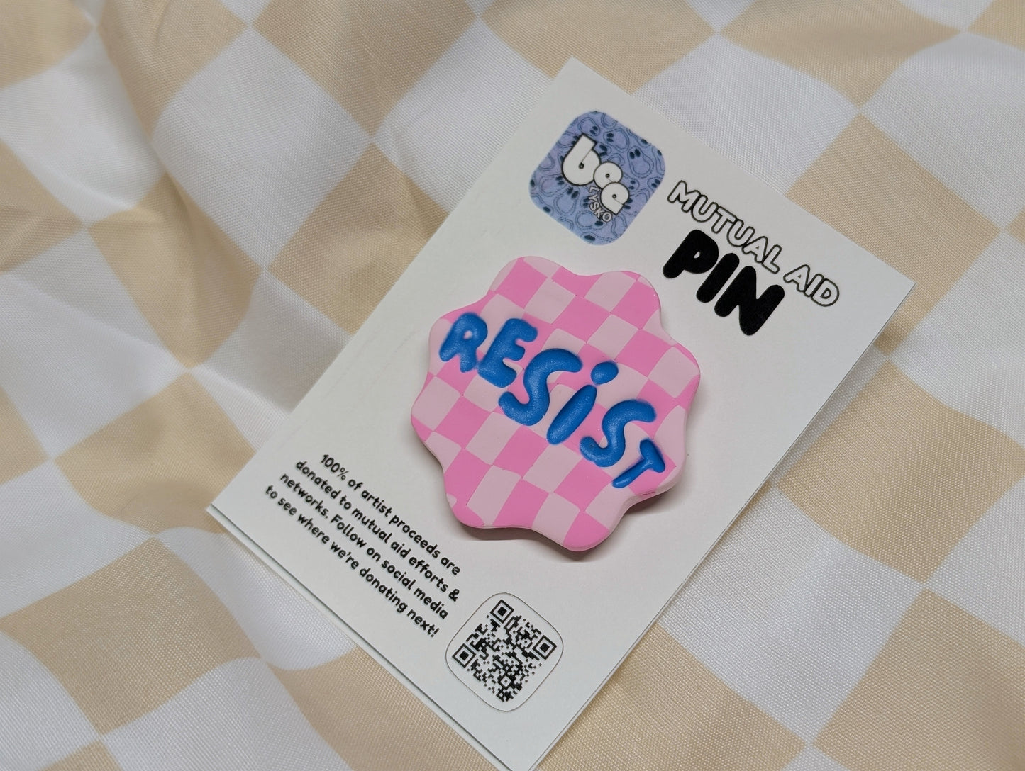 RESIST Pin - Pink Checks