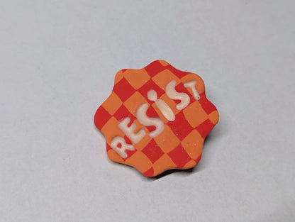 RESIST Pin - Orange Checks
